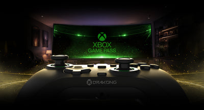 Gaming controller with Xbox Game Pass logo on screen in a dark room