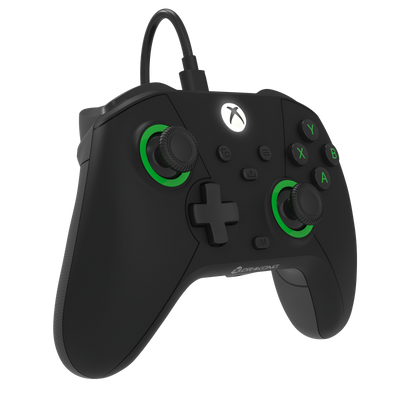 Black gaming controller with green accents on a white background